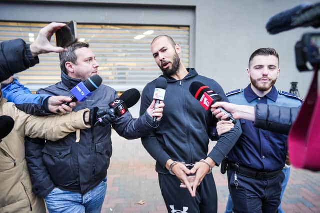 According to one poll, more than a quarter of young men have a favourable opinion of social media misogynist Andrew Tate, currently under house arrest in Romania amid an investigation into human trafficking (Picture: Mihai Barbu/AFP via Getty Images)